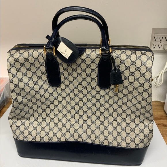 Gucci Handbags - Authentic Gucci GG Vintage travel handbag PVC leather.